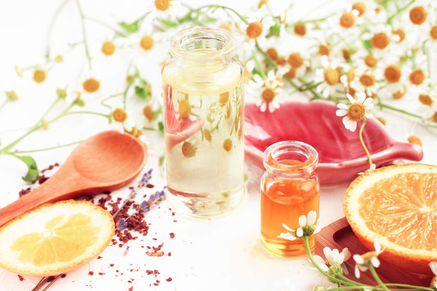 DIY spray surrounded by oranges and flowers