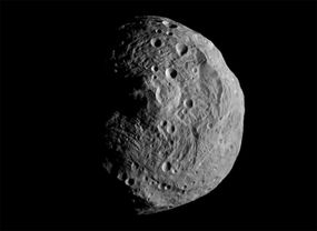 Vesta, as captured by NASA's Dawn spacecraft in 2011, features a mountain that rises more than 65,000 feet above the asteroid's south pole.