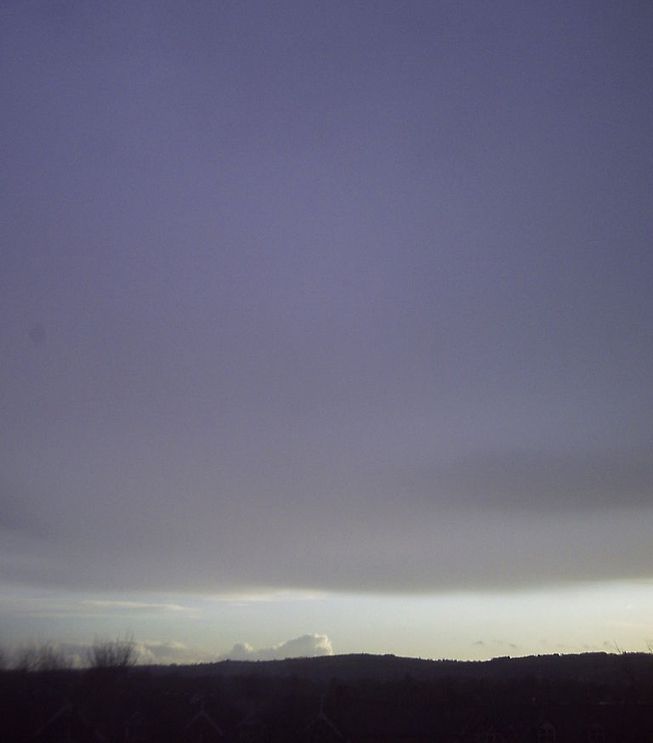 Altostratus opacus looms over a horizon