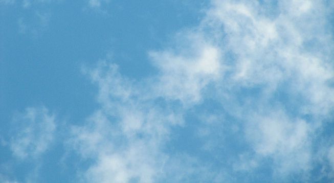 Cumulus fractus clouds against a blue sky.