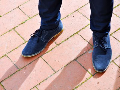 Blue Suede men's shoes on boardwalk