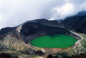 crater like with green water and tall left side