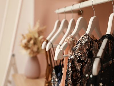 fancy rental clothes on hangers