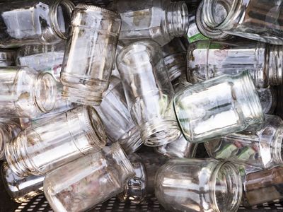 Pile of glass jars in a basket