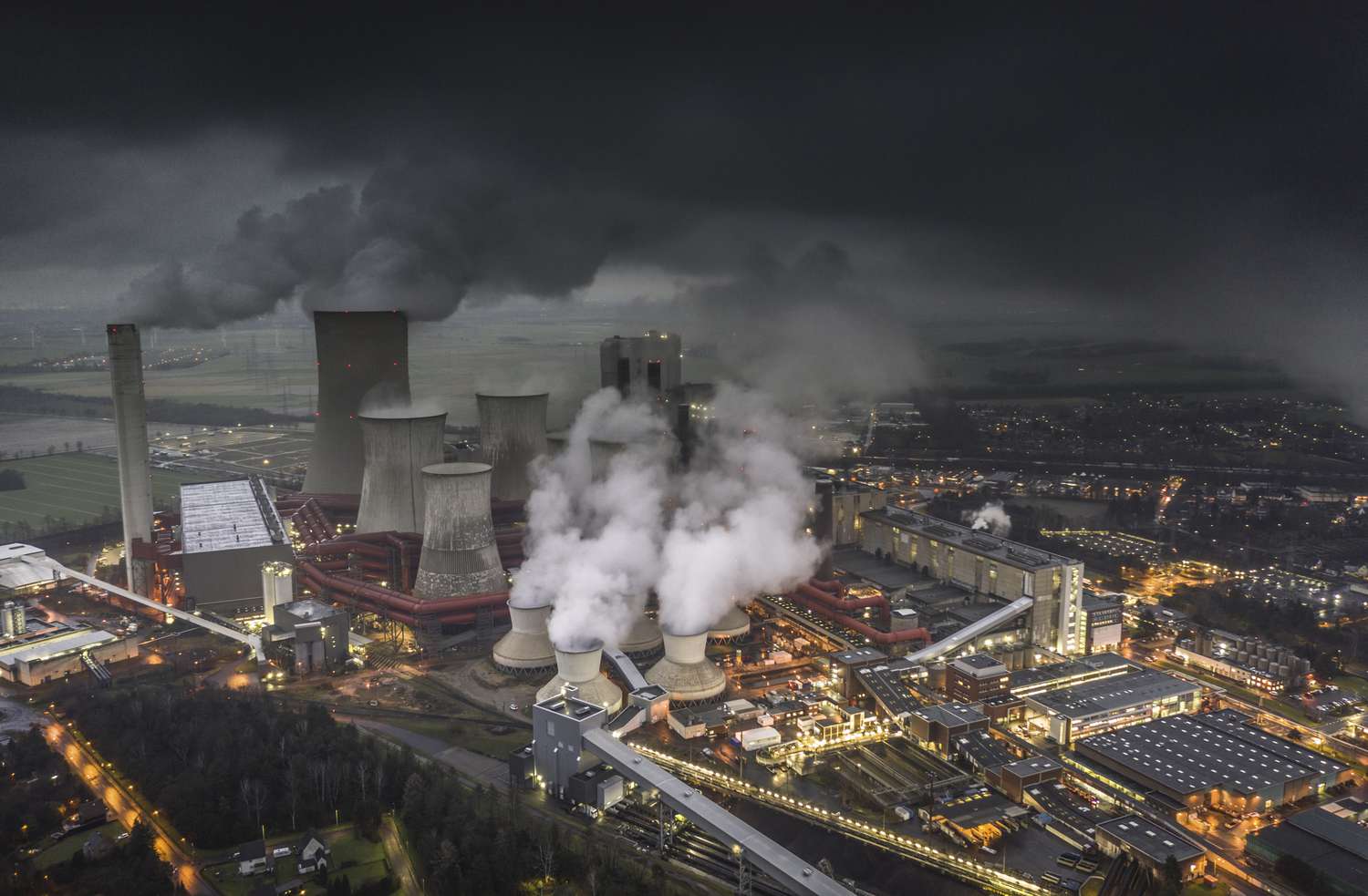 Aerial view of emissions rising from the cooling towers of a lignite fired power station in Germany.