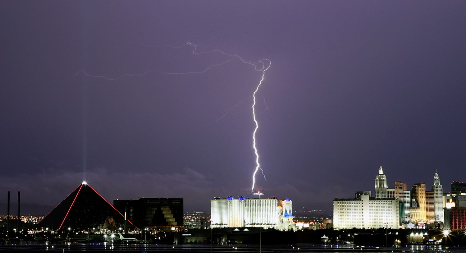 Lightning flashes behind downtown Las Vegas, Nevada.