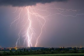 Lightning strikes over a town