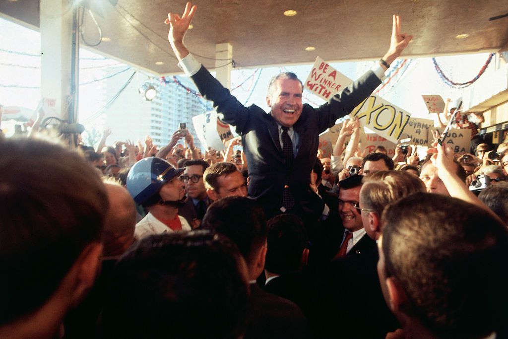Richard Nixon celebrating with supporters of his