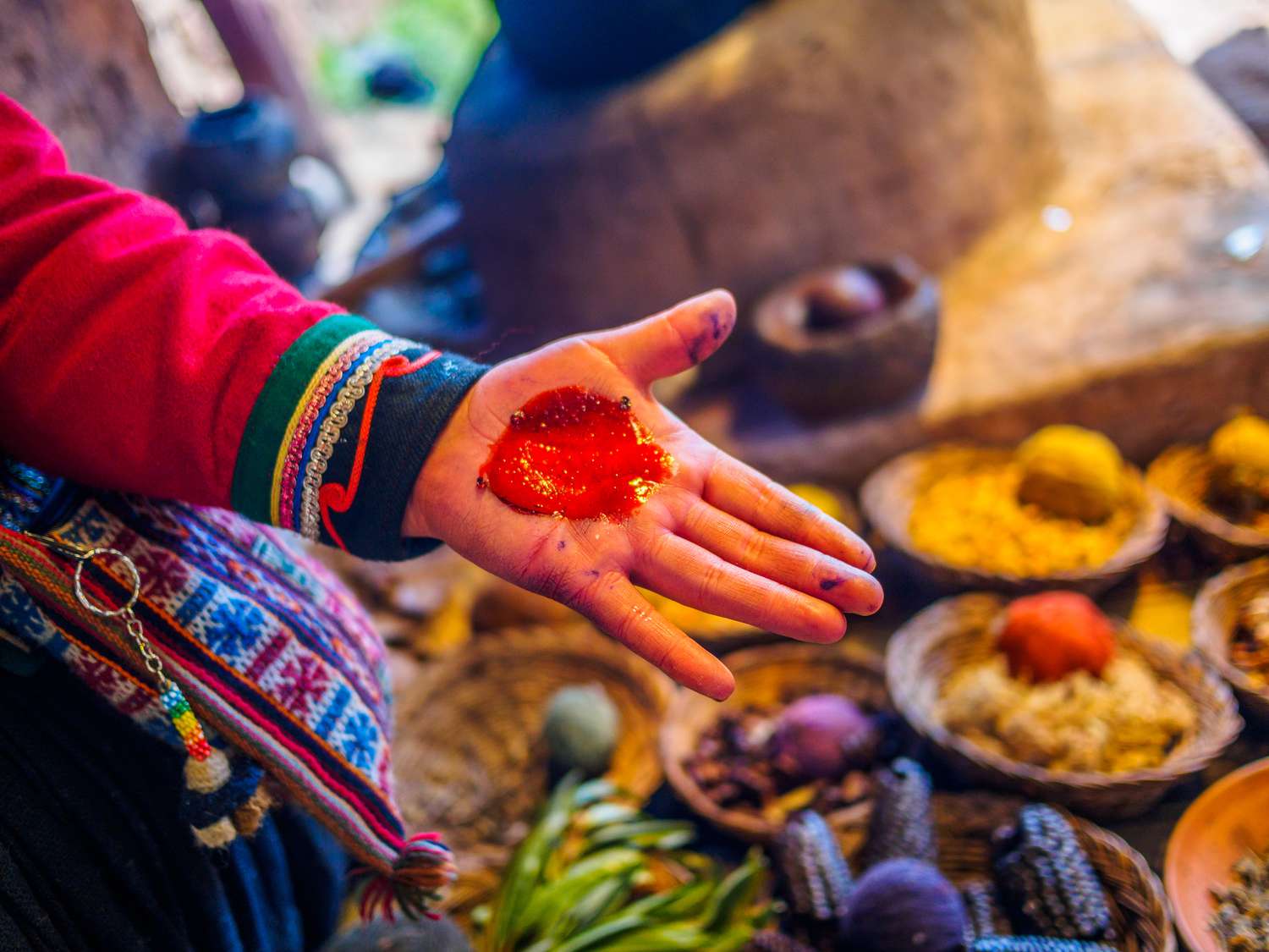 Carmine of cochineal on woman hand in Peru