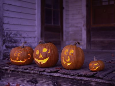 Carved jack-o-lanterns on a stoop