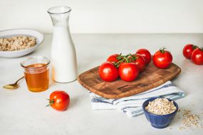 honey, pitcher of milk, tomatoes, and rolled oats are all natural facial cleansers
