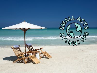 Two empty beach chairs on a beautiful beach with the words "small acts big impact"