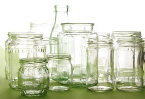 Variety of empty clear glass bottles and jars